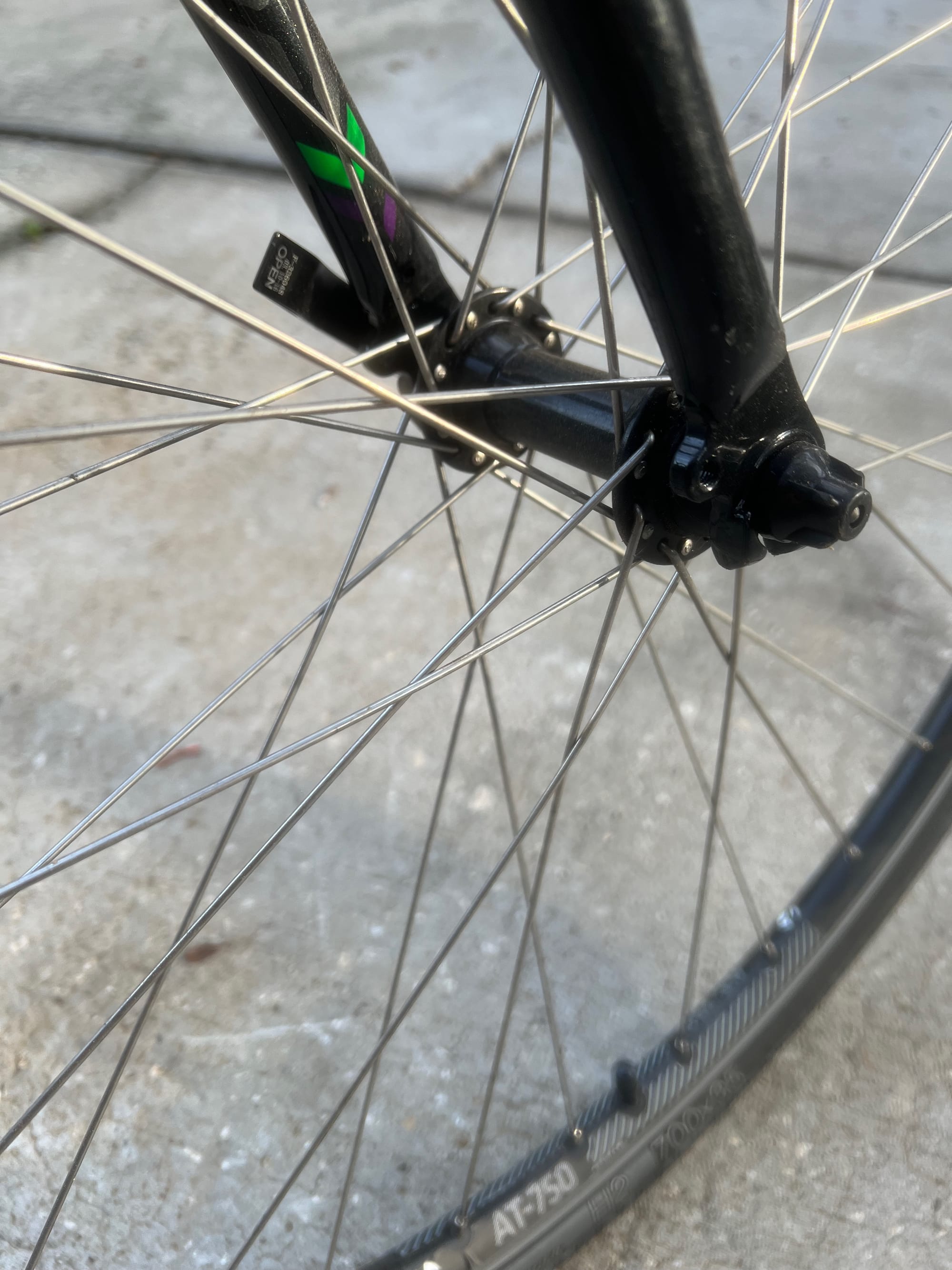 Zoomed in view of the earlier bicycle wheel showing how spokes cross each other to reinforce each other.