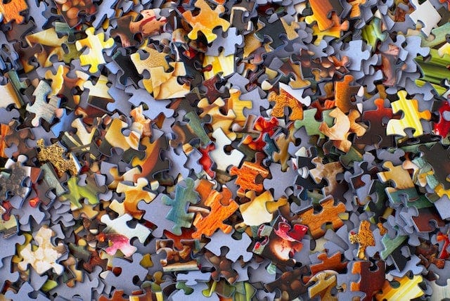 large collection of jigsaw puzzle pieces