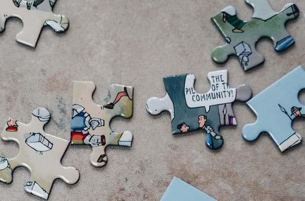 puzzle pieces and one says community